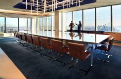 Stunning MESA table with etched glass surface and HALO storage with integrated gallery seating form the centerpiece of this amazing space. thumbnail